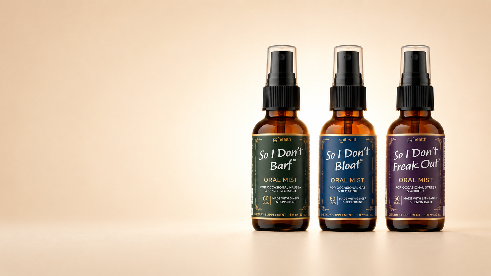 Three amber spray bottles of So I Don't Barf, So I Don't Bloat, and So I Don't Freak Out Oral Mist lined up on a warm beige background. The bottles have black sprayers and labels in dark green, navy blue, and purple with white text.
